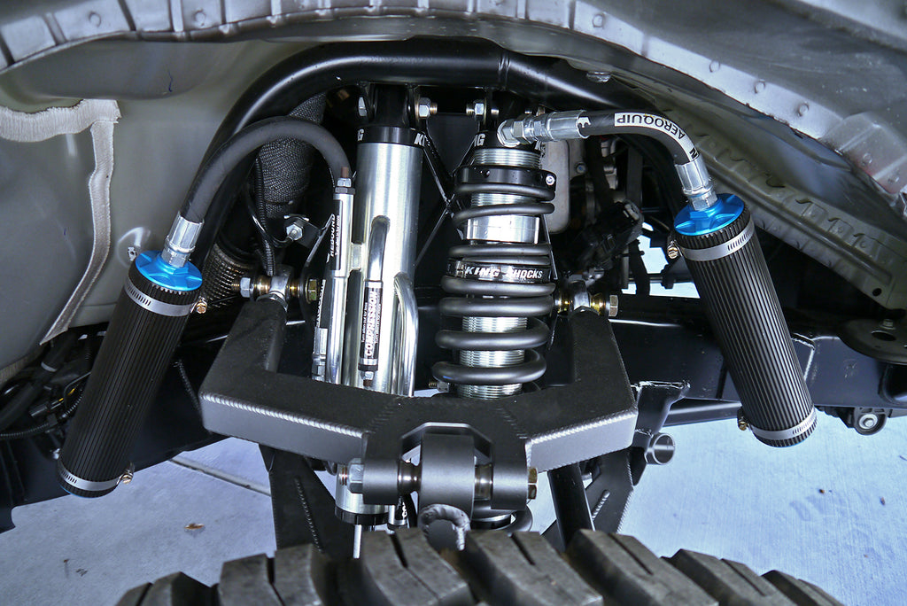 King Coilover shocks and springs with reservoirs, including a secondary external bypass shock with reservoir